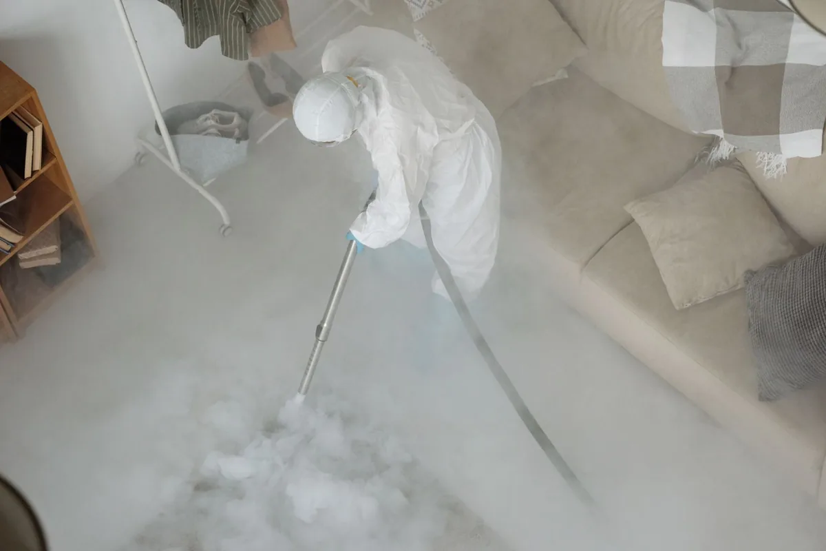 Biohazard cleanup technician in protective equipment, Baldwin, GA